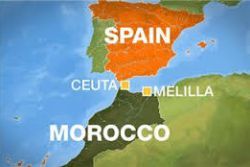 Dozens of migrants run across border in Spanish enclave Dozens of migrants run across border in Spanish enclave