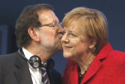 Merkel tells Rajoy of support for unity of Spain Merkel tells Rajoy of support for unity of Spain