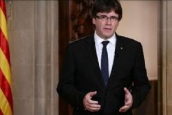 Catalan parties propose self-exiled former leader as president Catalan parties propose self-exiled former leader as president