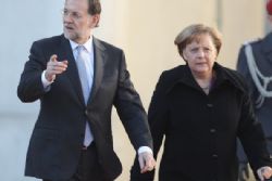 Merkel Presses Spain to Accept Bailout